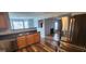 Modern kitchen with stainless steel appliances and a view of the living room at 1762 Wood Stork Drive, Hampton, GA 30228