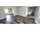 Bright living room with wood flooring, neutral paint, and natural light at 1762 Wood Stork Drive, Hampton, GA 30228