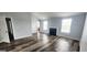 Bright living room with wood floors, fireplace, and ample natural light at 1762 Wood Stork Drive, Hampton, GA 30228