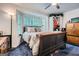 Comfortable bedroom with large bay window, ceiling fan, and dark furniture at 578 Mcgill Ne Pl # 578, Atlanta, GA 30312