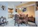 Dining area with a round table, upholstered chairs, and a view into the kitchen at 578 Mcgill Ne Pl # 578, Atlanta, GA 30312