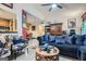Inviting living room featuring a blue sofa, floral armchairs, and a decorative coffee table at 578 Mcgill Ne Pl # 578, Atlanta, GA 30312