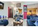 Open living area with floral armchairs, a blue sofa, and a view into the kitchen and dining area at 578 Mcgill Ne Pl # 578, Atlanta, GA 30312