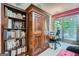 Bright interior with custom built-in bookcase and cabinet, and French doors to the outside at 578 Mcgill Ne Pl # 578, Atlanta, GA 30312