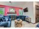 This living room boasts an open layout, lots of seating, and a cozy fireplace at 578 Mcgill Ne Pl # 578, Atlanta, GA 30312