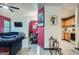 Comfortable living room with a blue sofa and floral chairs, open to the kitchen at 578 Mcgill Ne Pl # 578, Atlanta, GA 30312