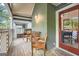 View of the porch with wooden bench and chairs at 578 Mcgill Ne Pl # 578, Atlanta, GA 30312