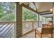 Covered porch with chairs and white railings at 578 Mcgill Ne Pl # 578, Atlanta, GA 30312
