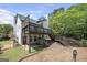 Large backyard featuring a deck, stairs, and a patio area at 9206 Denmeade Trce, Douglasville, GA 30135