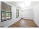 Finished basement featuring natural light from two windows and wood-look flooring at 9206 Denmeade Trce, Douglasville, GA 30135