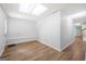 This finished basement features wood floors, neutral paint, and a closet at 9206 Denmeade Trce, Douglasville, GA 30135
