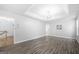 A bright and airy bedroom featuring hardwood floors and recessed ceiling lights at 9206 Denmeade Trce, Douglasville, GA 30135