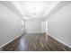 Large open concept bedroom features hardwood floors, large windows, and recessed ceilings at 9206 Denmeade Trce, Douglasville, GA 30135