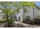 Exterior view of the home with a wooden deck and lush landscaping at 9206 Denmeade Trce, Douglasville, GA 30135