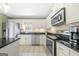 Bright kitchen featuring stainless steel appliances and countertops, with lots of natural light at 9206 Denmeade Trce, Douglasville, GA 30135