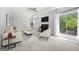 Bright living room features fireplace, sliding door, ceiling fan and neutral furniture at 9206 Denmeade Trce, Douglasville, GA 30135