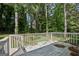 The backyard deck offers an area for relaxation and enjoying the lush surroundings at 4954 Browns Mill Rd, Lithonia, GA 30038