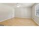 Image of an empty bedroom featuring a ceiling fan and natural light at 4954 Browns Mill Rd, Lithonia, GA 30038