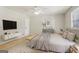 Cozy bedroom showcasing neutral tones, with a bed, side tables, and a decorative rug at 4954 Browns Mill Rd, Lithonia, GA 30038