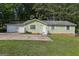 Charming single-story home featuring an attached two-car garage and a well-maintained front yard at 4954 Browns Mill Rd, Lithonia, GA 30038