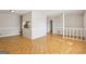 Open-concept living room with hardwood floors seamlessly connected to the kitchen through a large opening at 4954 Browns Mill Rd, Lithonia, GA 30038