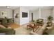 Cozy living room featuring hardwood floors, modern furnishings, and a flat-screen TV at 4954 Browns Mill Rd, Lithonia, GA 30038