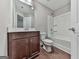 Bathroom featuring vanity, toilet, and bathtub with white tile surround at 1020 Broadview Dr, Marietta, GA 30062