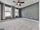 Bedroom features neutral walls, carpet flooring, two windows with curtains and a ceiling fan at 1020 Broadview Dr, Marietta, GA 30062