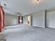Large bonus room with plush carpet, neutral walls, and several windows at 1020 Broadview Dr, Marietta, GA 30062