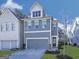 Exterior of charming three-story home with two-car garage, manicured lawn, and blue siding at 1020 Broadview Dr, Marietta, GA 30062