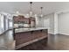 Modern kitchen featuring stainless steel appliances, dark wood cabinets, and an island with a gray countertop at 1020 Broadview Dr, Marietta, GA 30062