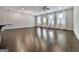 Bright and airy living room with hardwood floors, a ceiling fan, and multiple windows at 1020 Broadview Dr, Marietta, GA 30062