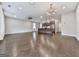 Open-concept living room with hardwood floors, a kitchen island, and modern lighting fixtures at 1020 Broadview Dr, Marietta, GA 30062