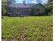 The backyard features a deck and grassy area that provides a private space for outdoor enjoyment at 3035 Landington Way, Duluth, GA 30096