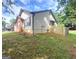 Side view of a home with light siding and a new wooden fence in the backyard at 3035 Landington Way, Duluth, GA 30096