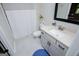 Bright bathroom featuring a vanity with a white countertop and blue rug at 457 Paynes Lake Rd, Carrollton, GA 30116