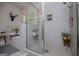 Modern bathroom featuring glass shower, neutral tile, and designer fixtures showcases contemporary design at 457 Paynes Lake Rd, Carrollton, GA 30116
