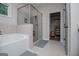 Spa-like bathroom with soaking tub, glass shower, and neutral tile design creates a relaxing and luxurious experience at 457 Paynes Lake Rd, Carrollton, GA 30116