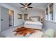 Airy bedroom featuring a comfortable bed, with a unique rug that adds a touch of style and warmth at 457 Paynes Lake Rd, Carrollton, GA 30116