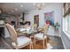Bright dining area with a glass-topped table, seating for four, and natural light from a nearby window at 457 Paynes Lake Rd, Carrollton, GA 30116