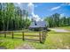 Exterior view of house with fenced backyard and driveway at 457 Paynes Lake Rd, Carrollton, GA 30116