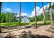 Lovely exterior view of home with a large front yard and charming wooden fence at 457 Paynes Lake Rd, Carrollton, GA 30116