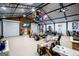 Spacious garage featuring high ceilings, garage doors, a wall-mounted television and ample workspace at 457 Paynes Lake Rd, Carrollton, GA 30116