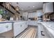 Well-equipped kitchen showcasing white cabinets, stainless steel appliances, granite countertops, and stylish pendant lighting at 457 Paynes Lake Rd, Carrollton, GA 30116