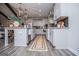 Spacious kitchen featuring white cabinetry, black subway tile backsplash, and stainless steel appliances at 457 Paynes Lake Rd, Carrollton, GA 30116
