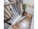 Elegant staircase with hardwood steps, wrought iron railings, and decorative accents adds character to the home at 457 Paynes Lake Rd, Carrollton, GA 30116