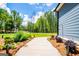 Landscaped walkway leading to the home, showcasing the well-maintained yard at 457 Paynes Lake Rd, Carrollton, GA 30116