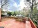 Relaxing backyard deck showcasing beautiful landscaping, lush greenery, and a tranquil setting at 110 Vicarage Ct, Johns Creek, GA 30005