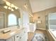 Bathroom featuring dual vanities, a shower, and a separate toilet room at 110 Vicarage Ct, Johns Creek, GA 30005