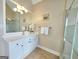 Bathroom vanity with drawers and cabinet, chrome faucet, and decorated with a white orchid at 110 Vicarage Ct, Johns Creek, GA 30005